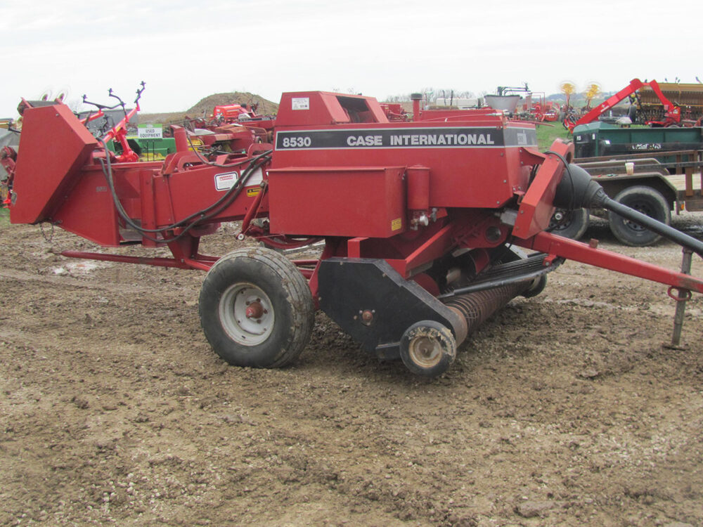 Used Case International 8530 inline baler with thrower.