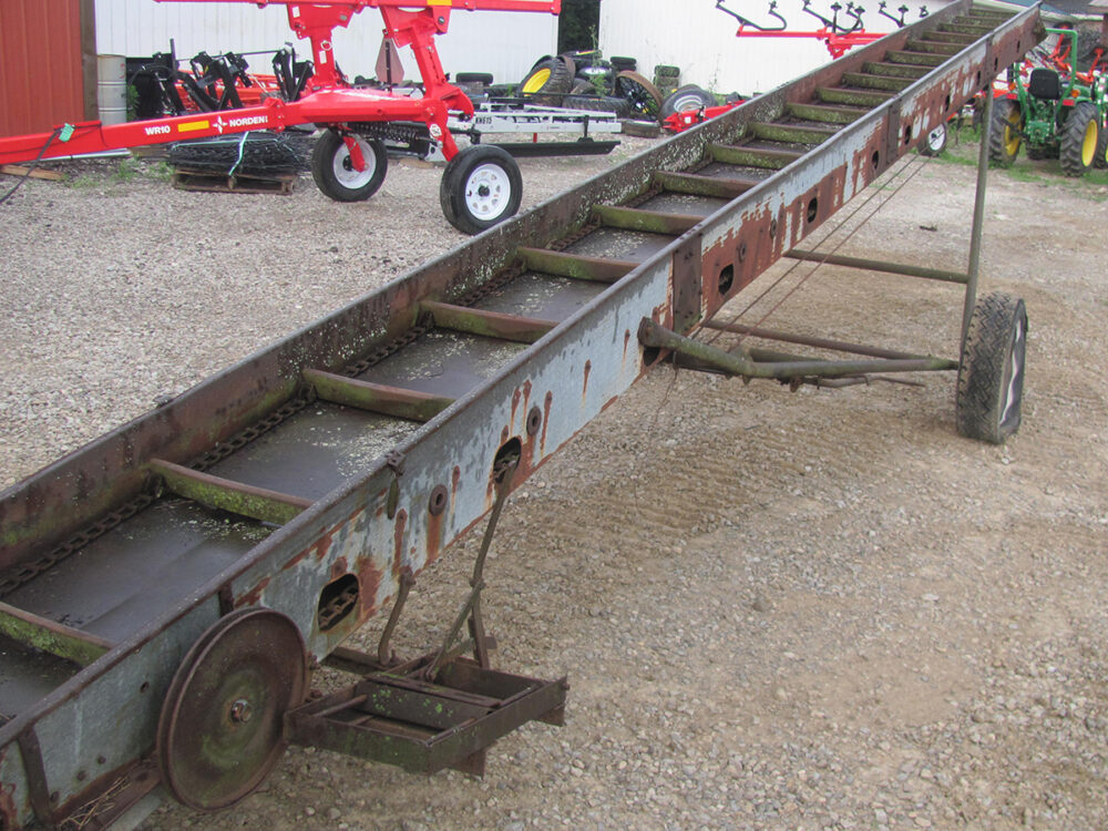 Used elevator with broken sprocket, shot tires, missing chain and bad bearings.