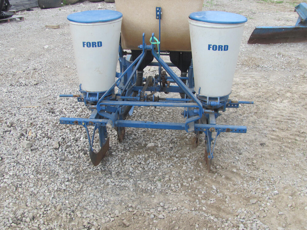 Used 2-row, 3-point Ford corn planter in fair condition.