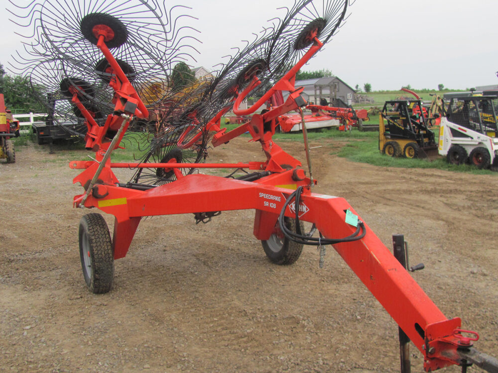 Used Kuhn SpeedRake 108 wheel rake with 8 wheels and a kicker wheel, in good condition.