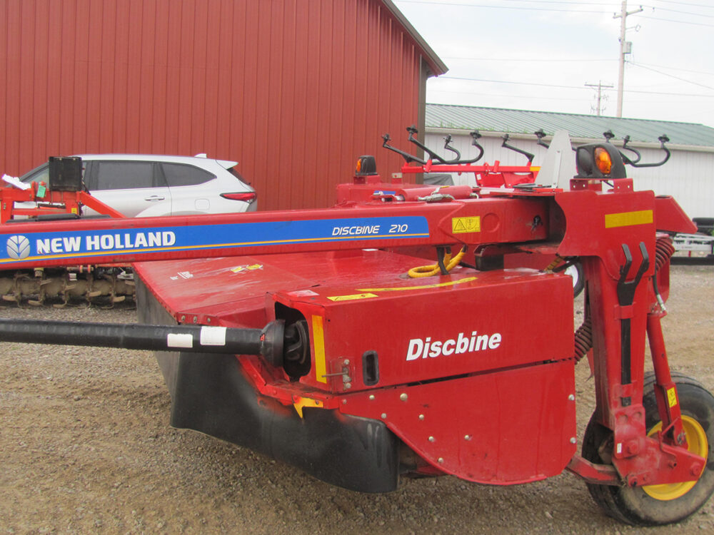Used 2022 model New Holland 210-disc bine with 1500 acres on it, ready to go.