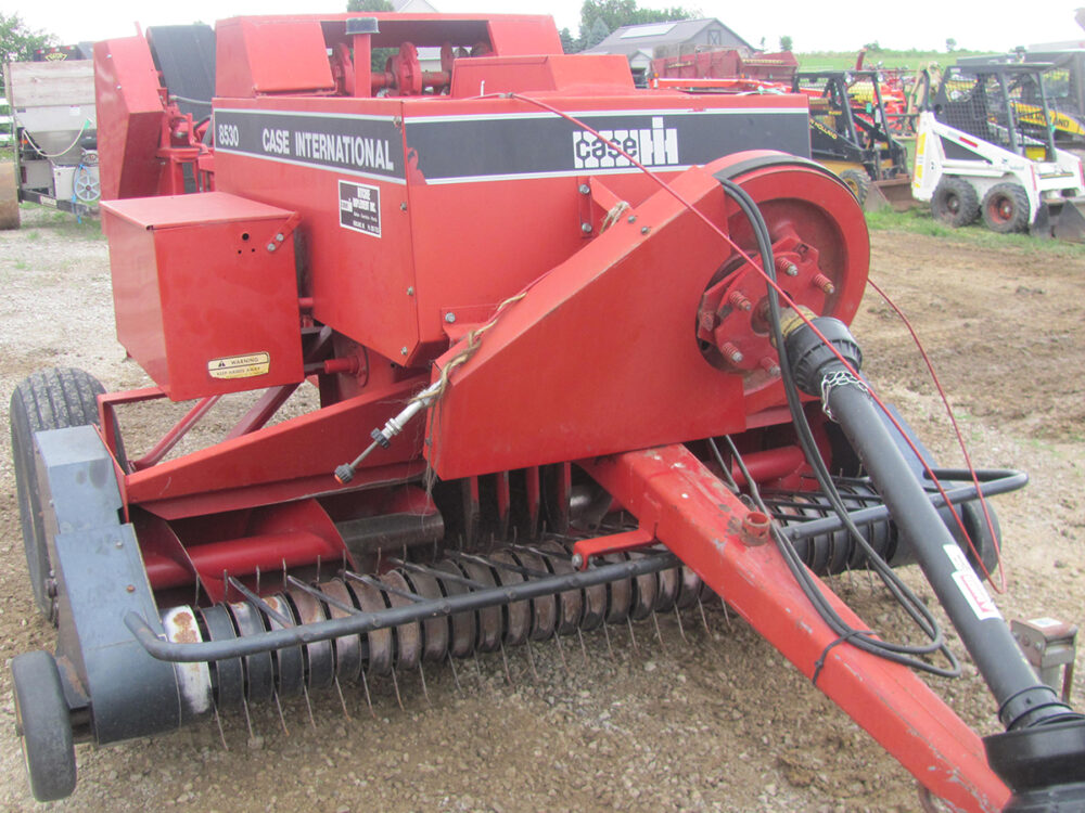 Used Case 8530 inline baler with a thrower in good condition.