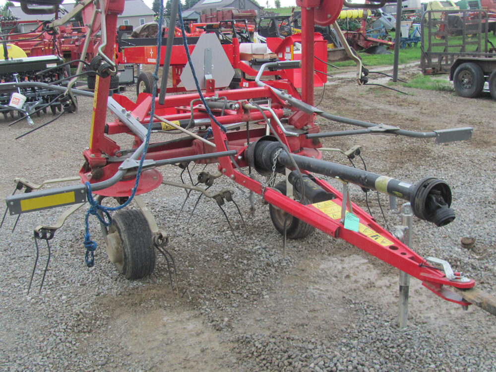 Used 4-star Massey tedder in good condition.