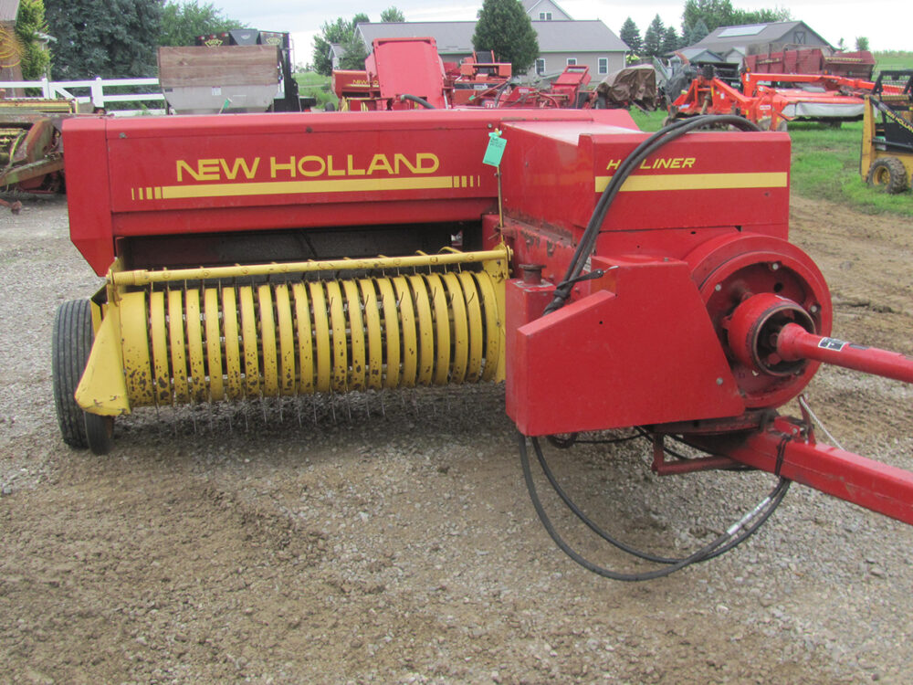 Used New Holland 311 baler with thrower, in good condition, though one hay wedge needs replacement.
