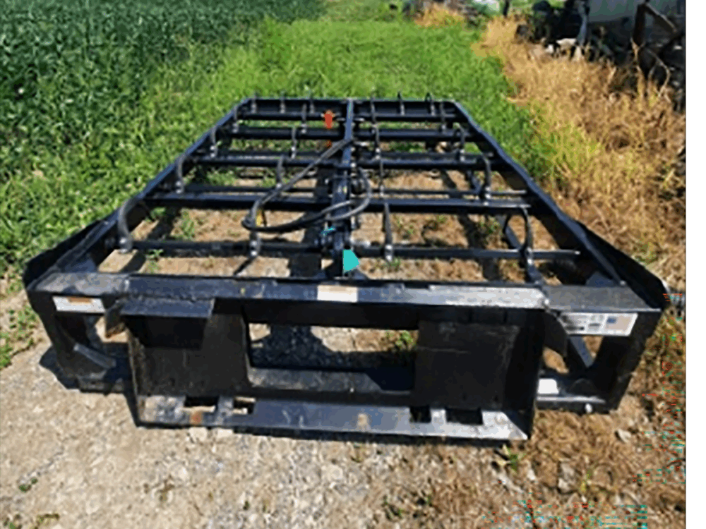 Used 10-bale Norden bale grabber with skid steer mounting brackets and flat faced hydraulics in good condition.