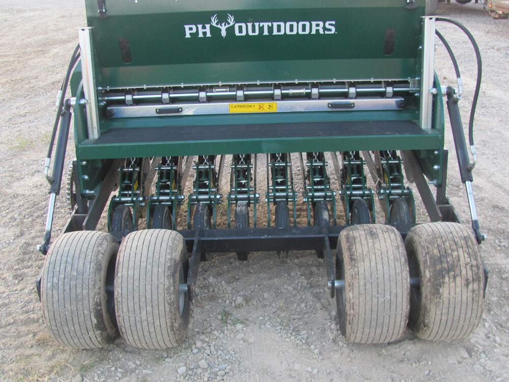 Barely used 60" Genesis 5 PH Drill with wheel kit and mechanical lift (cordless drill setup), foam-filled wheels, 8 planting rows spaced at 7.5", and an 8-bushel seed box.