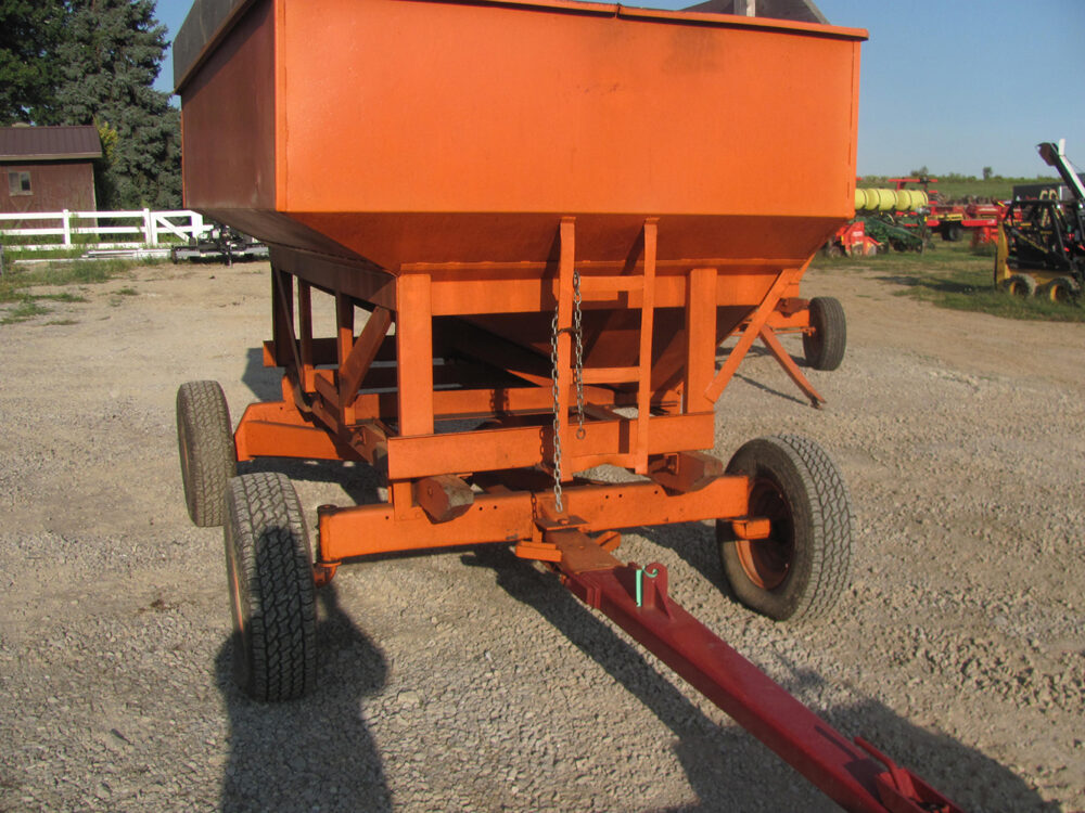 Used gravity wagon, average size with air tires and new quick hitch tongue, unloading door needs a small weld and some rust inside chute opening, otherwise in good condition.