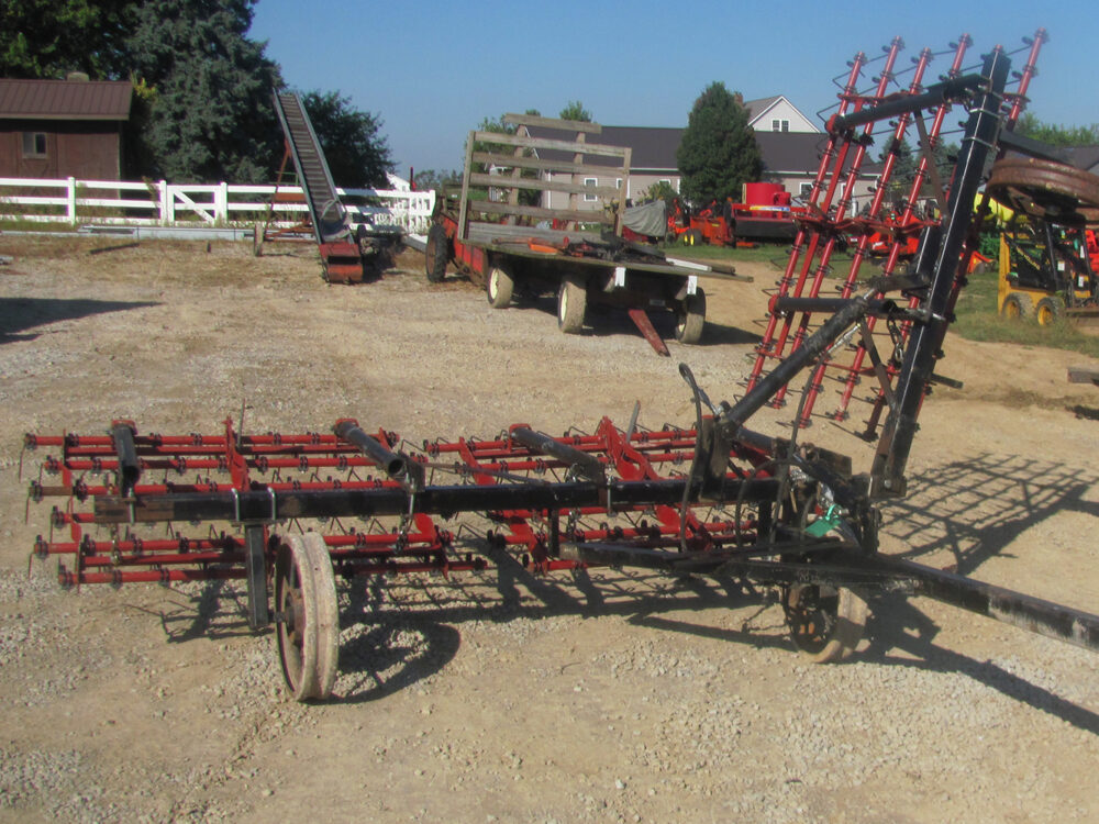 Used Einböck 15' tine weeder with 5' raised section, in fair condition.