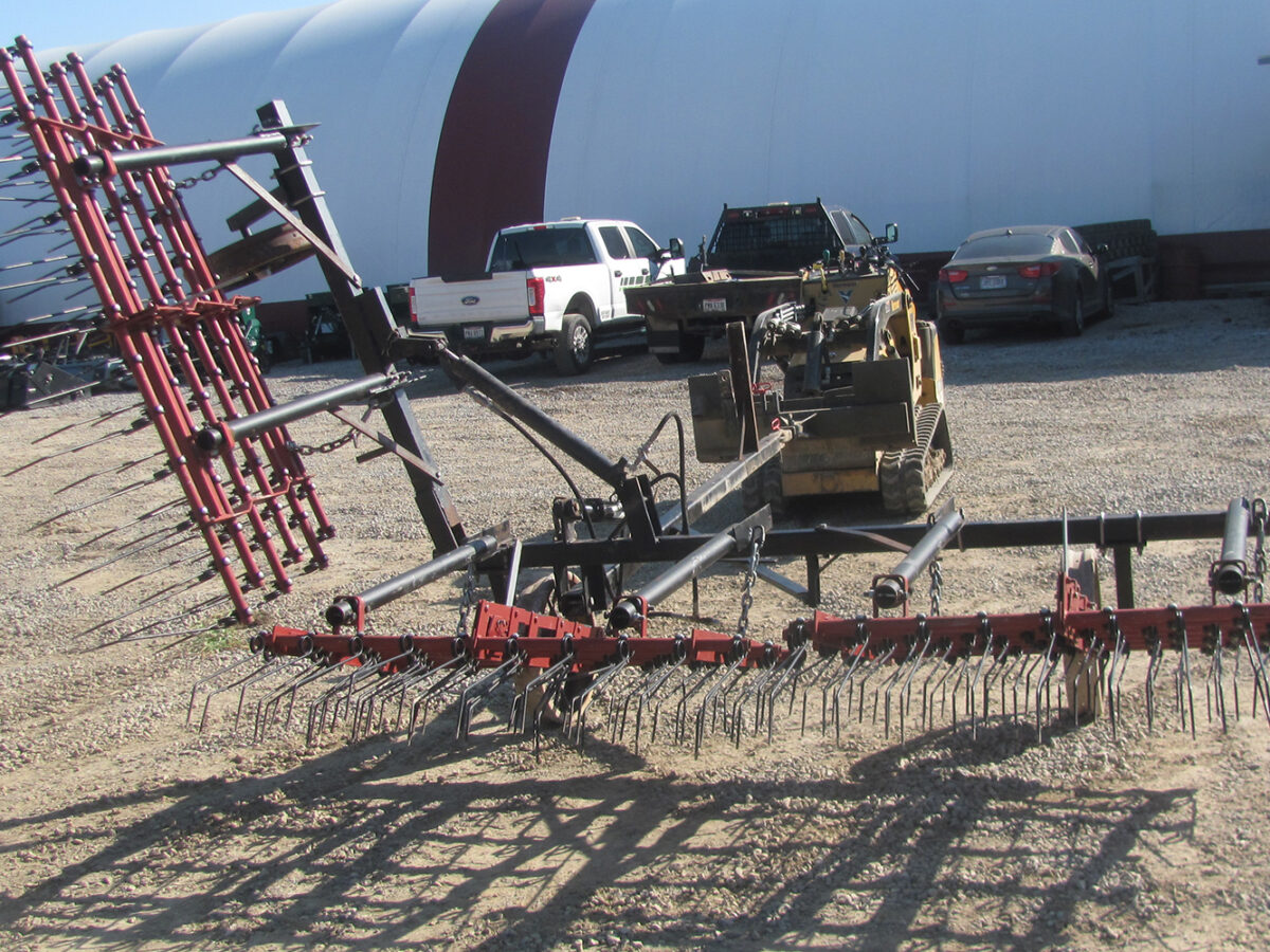 Used Einböck 15' tine weeder with 5' raised section, in fair condition.