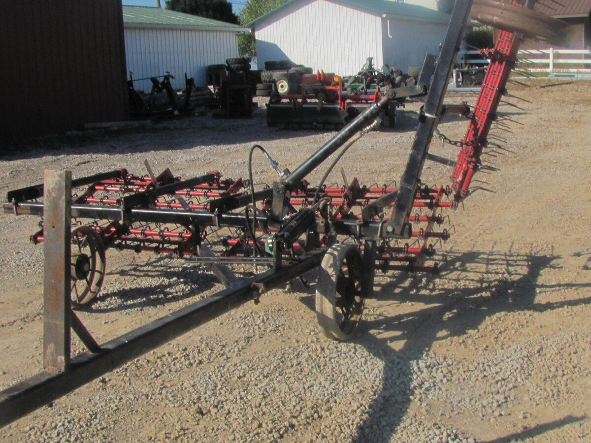Used Einböck 15' tine weeder with 5' raised section, in fair condition.