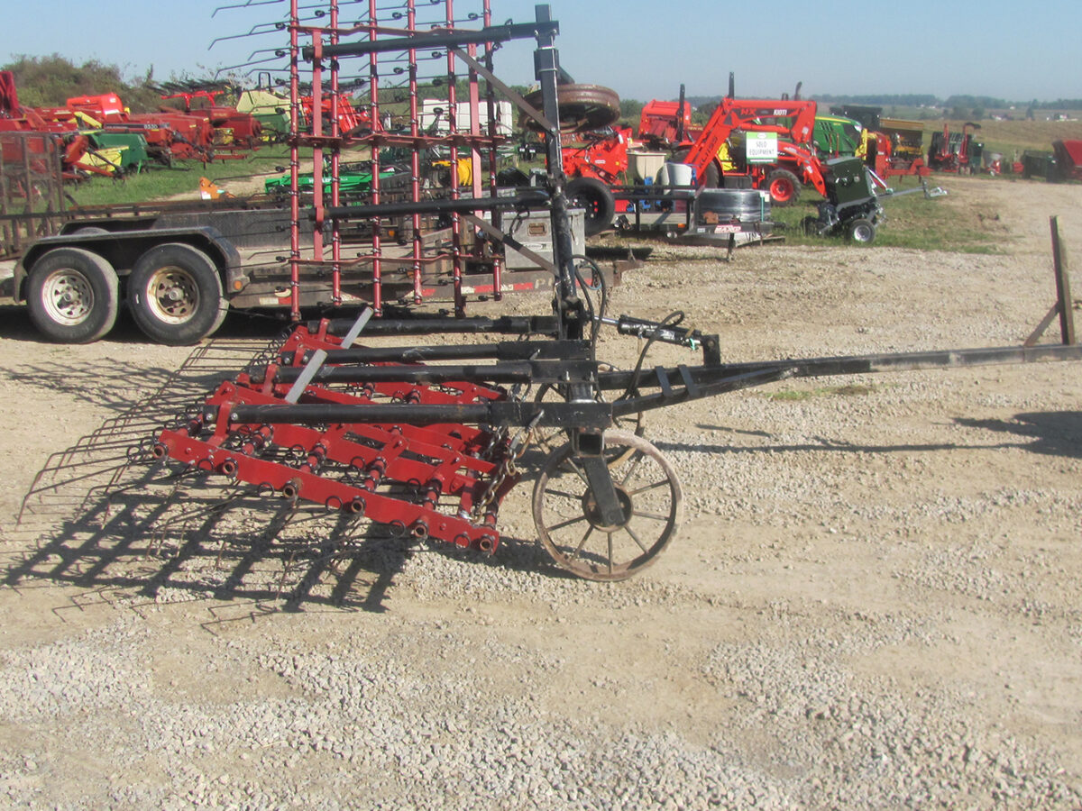 Used Einböck 15' tine weeder with 5' raised section, in fair condition.