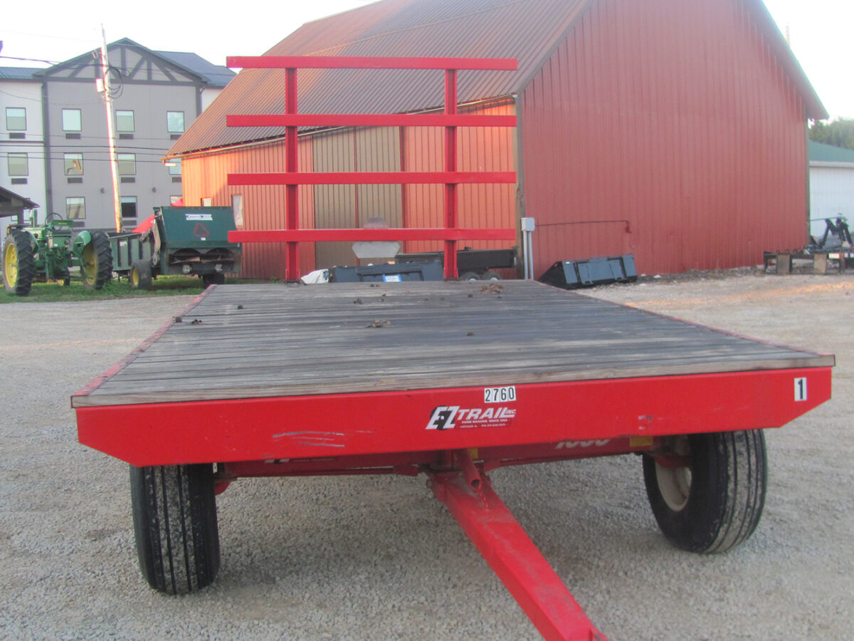 Used EZ Trail flat bed wagon, 8 x 20 with rear upright, in excellent condition, serial #E210549.