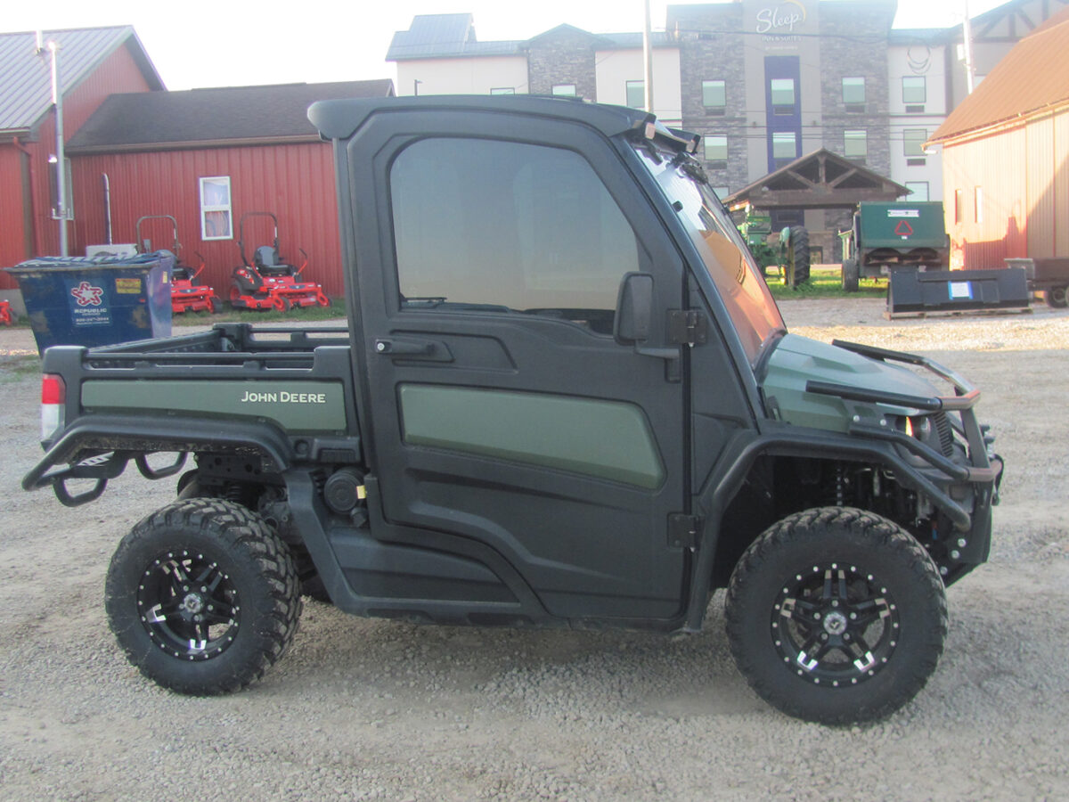 Used 2022 John Deere Gator XUV835M UTV with 4x4, cab, AC/heat, gas engine, radio, winch, power dump bed, 2,496 miles, 496 hours, serial #1M0835MDTN050674 — a nice, clean unit.