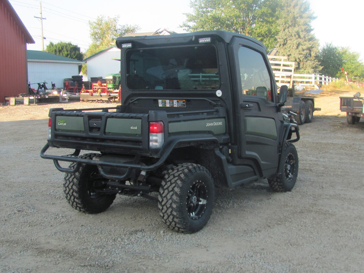 Used 2022 John Deere Gator XUV835M UTV with 4x4, cab, AC/heat, gas engine, radio, winch, power dump bed, 2,496 miles, 496 hours, serial #1M0835MDTN050674 — a nice, clean unit.