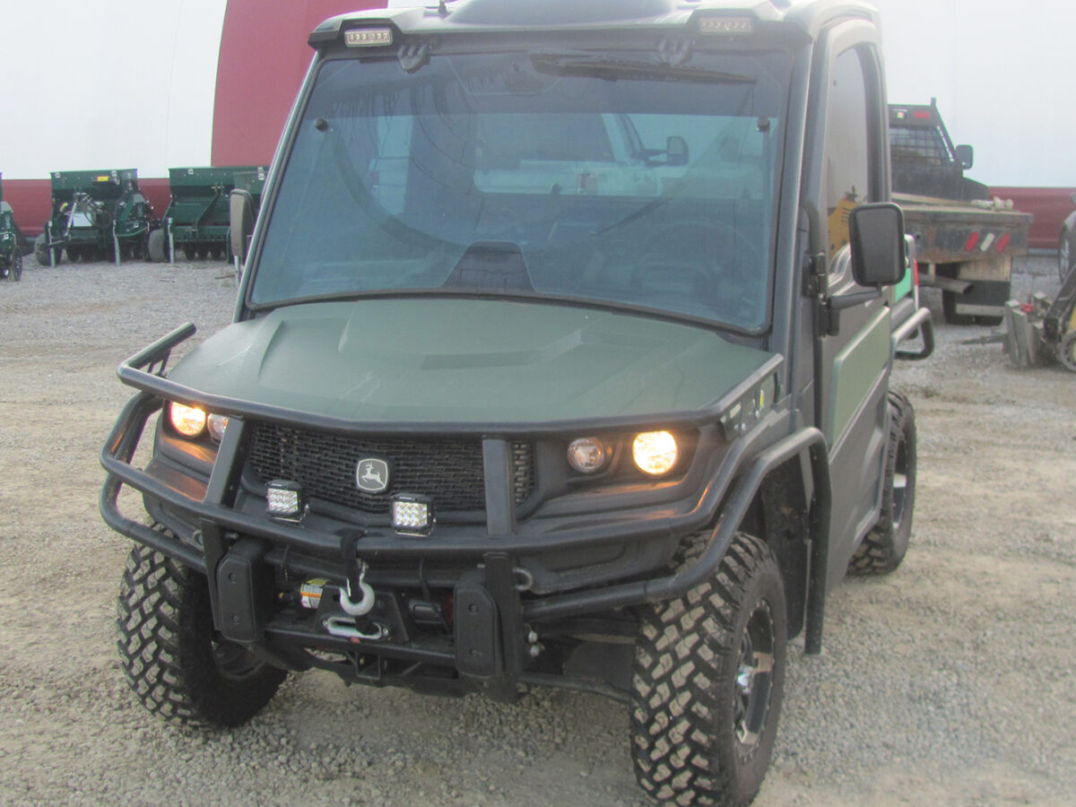 Used 2022 John Deere Gator XUV835M UTV with 4x4, cab, AC/heat, gas engine, radio, winch, power dump bed, 2,496 miles, 496 hours, serial #1M0835MDTN050674 — a nice, clean unit.