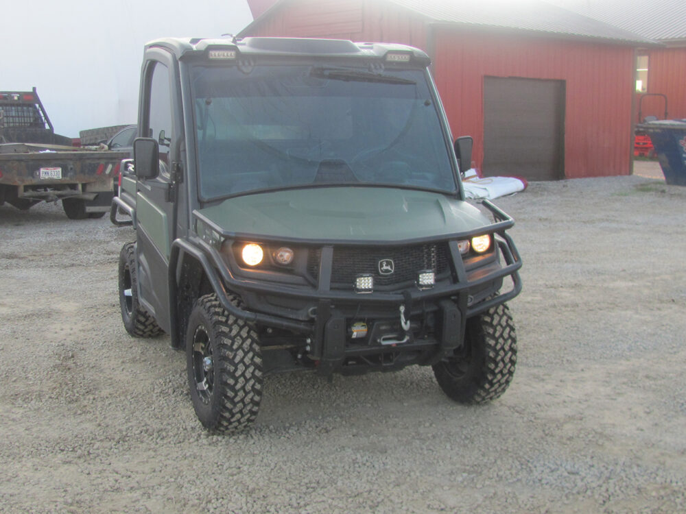 Used 2022 John Deere Gator XUV835M UTV with 4x4, cab, AC/heat, gas engine, radio, winch, power dump bed, 2,496 miles, 496 hours, serial #1M0835MDTN050674 — a nice, clean unit.
