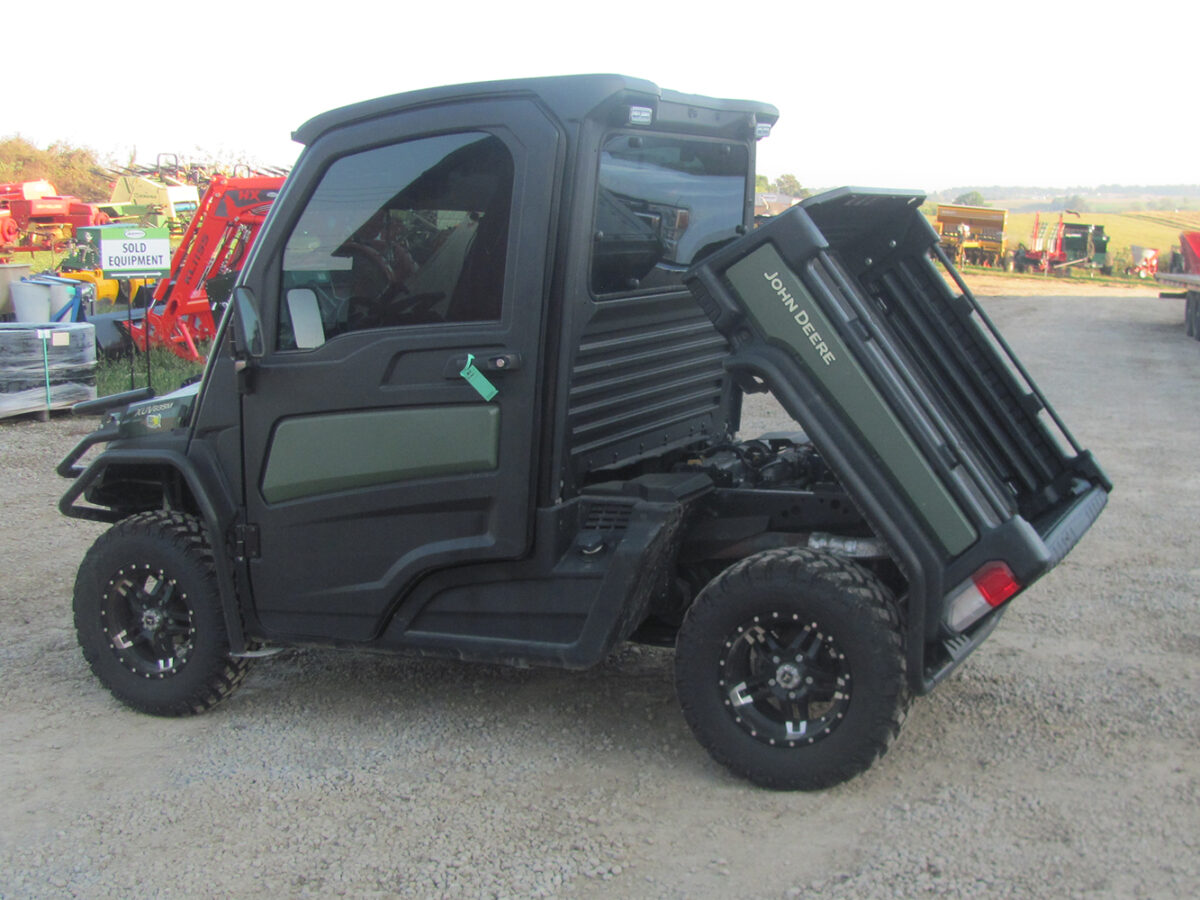Used 2022 John Deere Gator XUV835M UTV with 4x4, cab, AC/heat, gas engine, radio, winch, power dump bed, 2,496 miles, 496 hours, serial #1M0835MDTN050674 — a nice, clean unit.