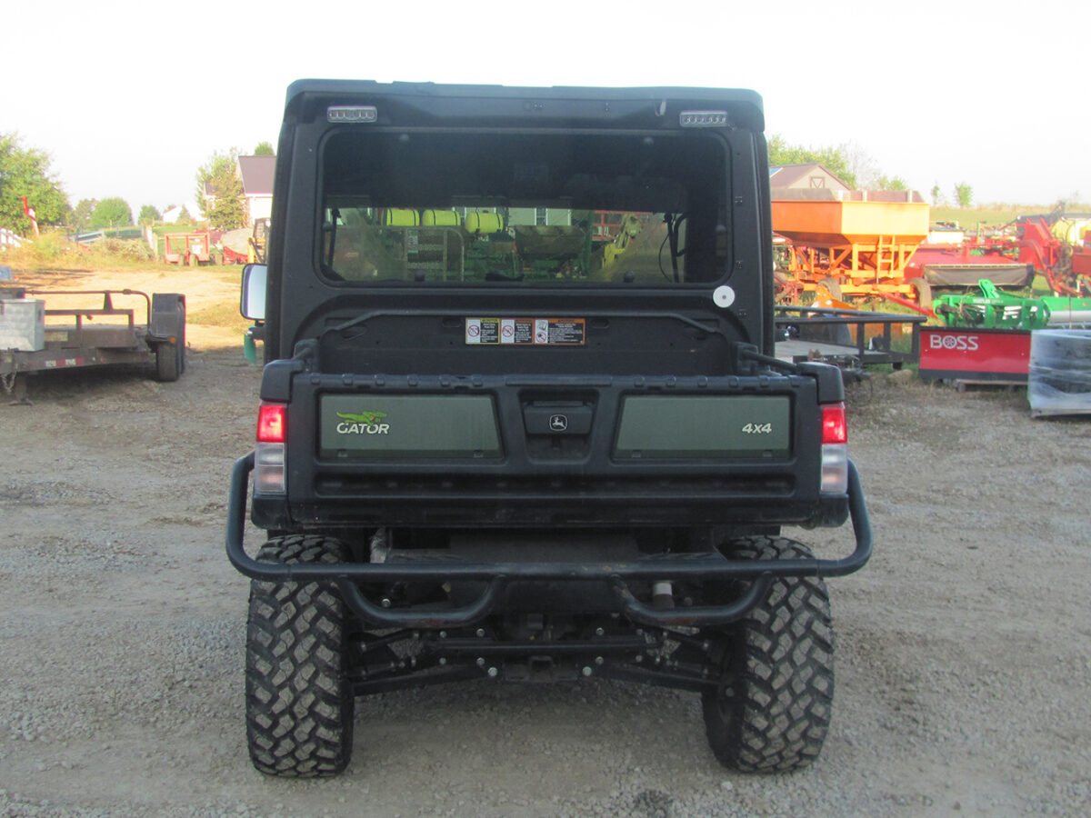 Used 2022 John Deere Gator XUV835M UTV with 4x4, cab, AC/heat, gas engine, radio, winch, power dump bed, 2,496 miles, 496 hours, serial #1M0835MDTN050674 — a nice, clean unit.