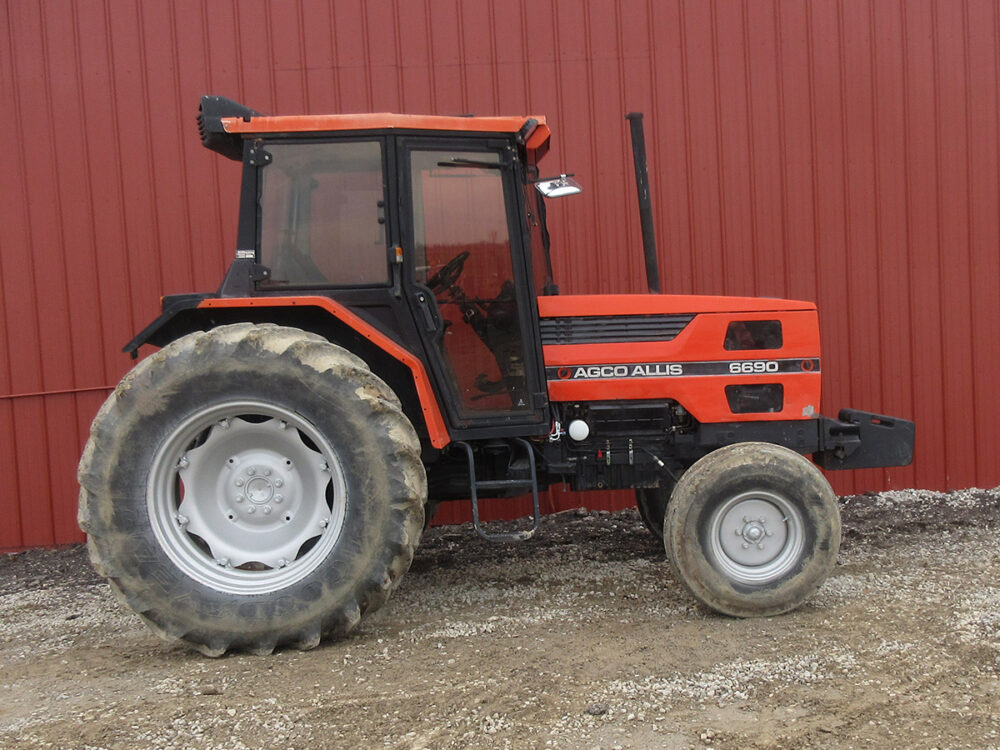 Used AGCO Allis 6690 tractor with cab, 3,316 hours, serial #001911, 2-wheel drive, 86.9 HP, and estimated model year range 1991–1997.