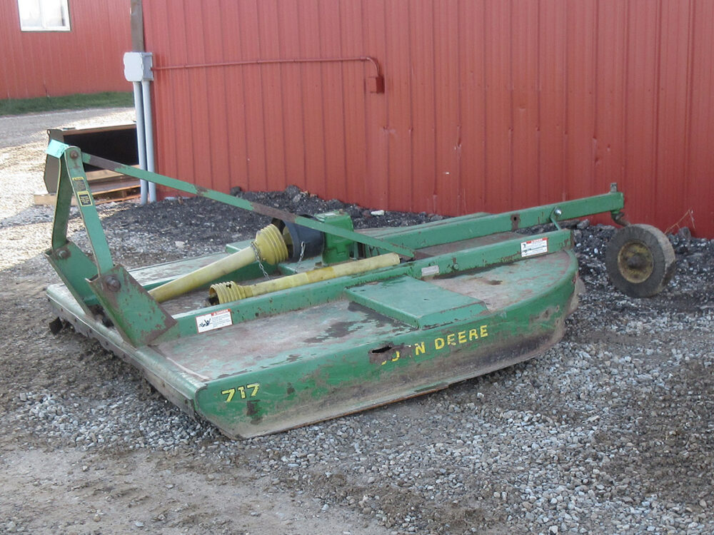 Used John Deere 717 brush hog with 7' cutting width, stump jumper plate, one-owner machine, and serial #W00717K002550.