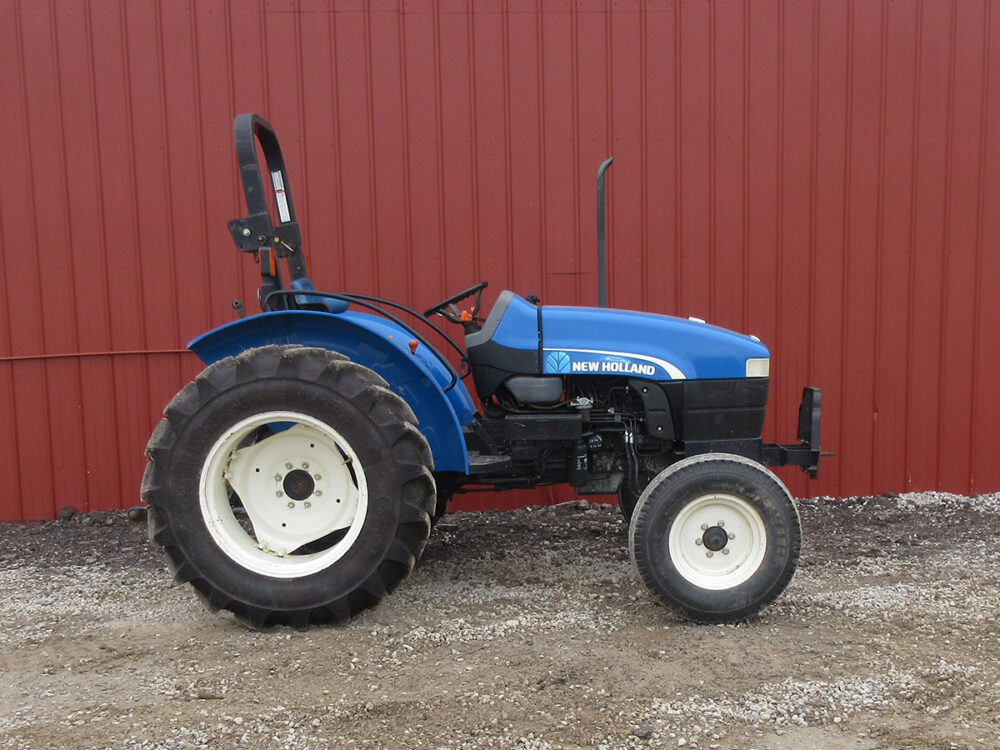 Used New Holland TN55 tractor (model WKMTR55A) with 2,625 hours, ROPS, 2-wheel drive, 55 HP, serial #NH7277575, approximately a 2007 model, and recently installed new rear tires.