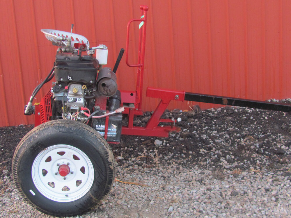 Used PTO cart with 23 HP engine, rims, and tires in good condition.