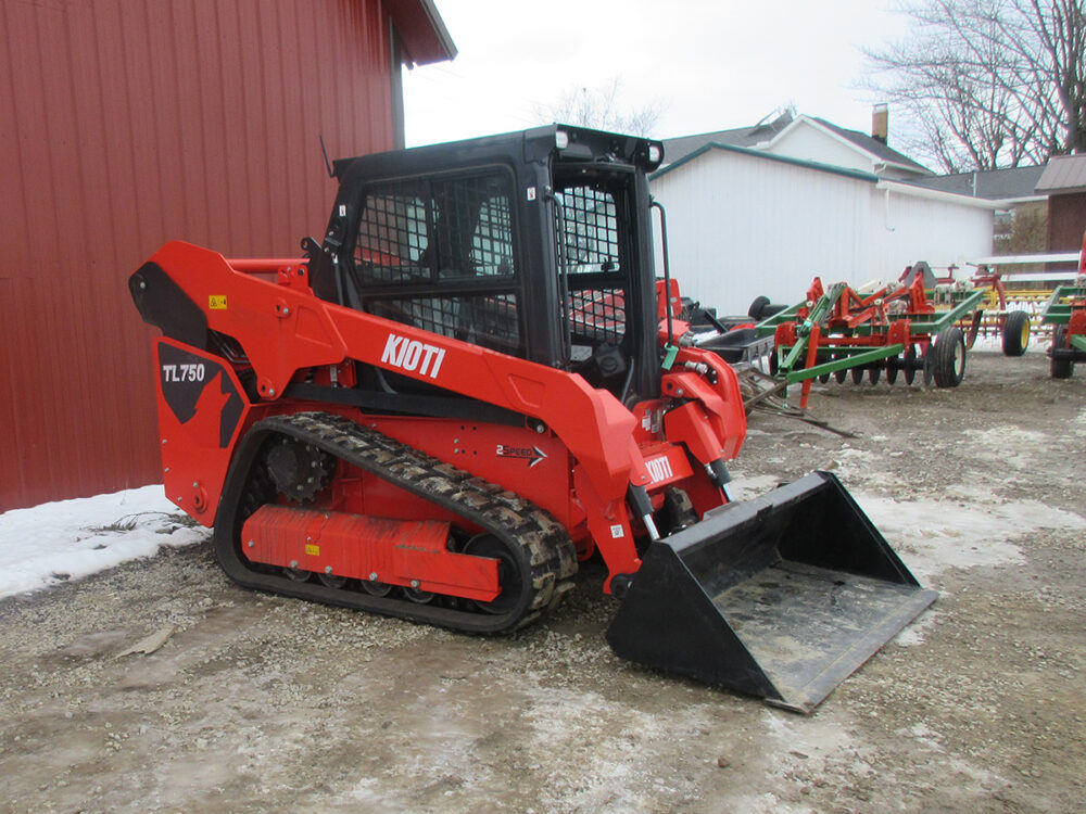 Used Kioti TL750 track loader with 74 HP, enclosed cab with heat and air, quick attach, rear camera, and serial #RX5NA0118.