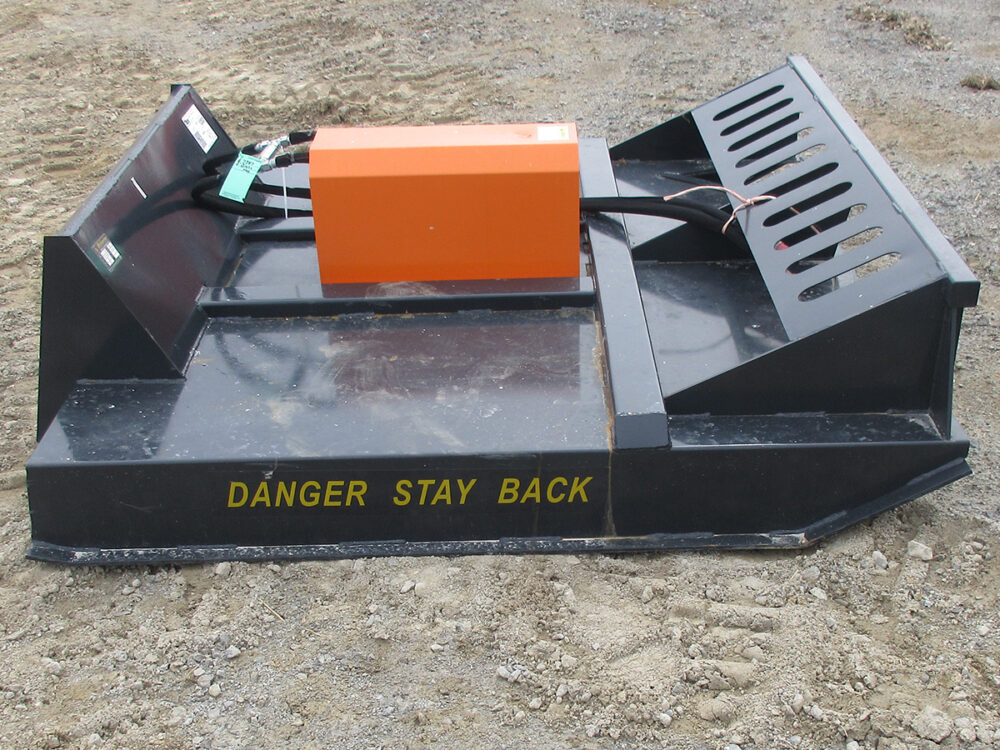 Used Wolverine BC-13-72W brush hog with 6' cutting width, skid loader mount, and serial #2W-04604.