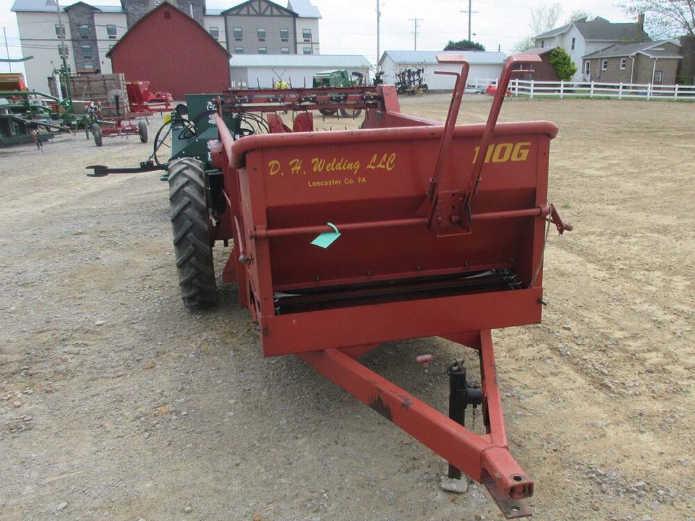 Used DH Welding 110 GD Manure Spreader, air tires, excellent condition, spinners and fines pan included.