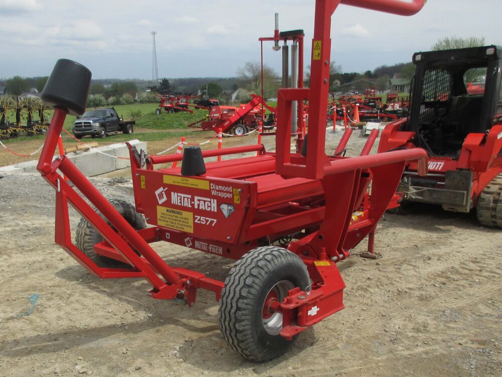 Used equipment: Diamond wrapper, trailed unit with cable control for lift, rotate, and tip, featuring a programmable counter/control, self-loading and dumping capability, maximum bale weight of 1,800 lbs, minimum 45 HP required, less than 60 bales