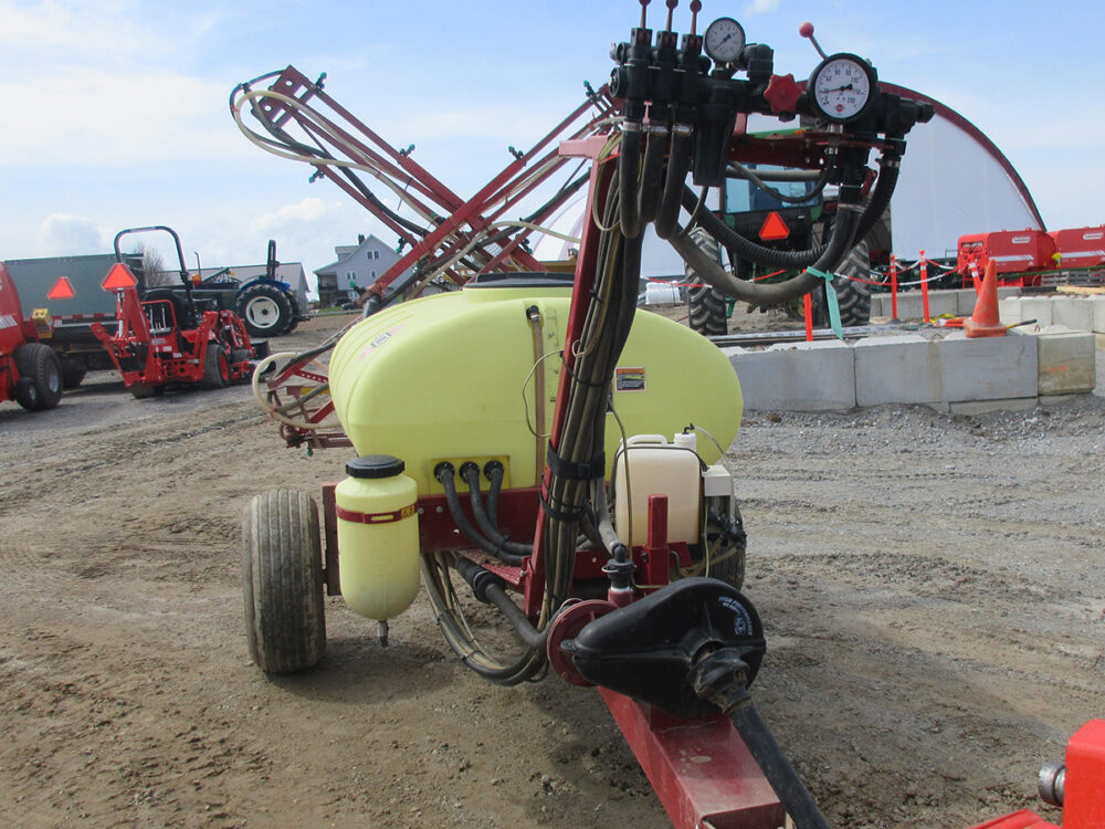 Used Hardi sprayer with 325-gallon tank, pull-type design, 35' booms, PTO centrifugal pump, foam marker, 3-section manual control, and serial #0312101325.