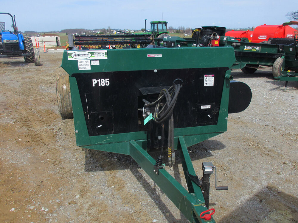 Used Lancaster 185-bushel manure spreader with PTO drive, fertilizer spinners, air tires, excellent condition, and serial #2990.