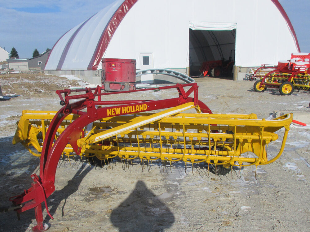 Used New Holland 258 Rolabar rake in good condition with serial #404425.