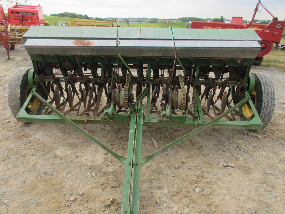 Used John Deere Van Brunt FB-A grain drill with 13 holes, single-disc openers, working condition, and serial #5211.