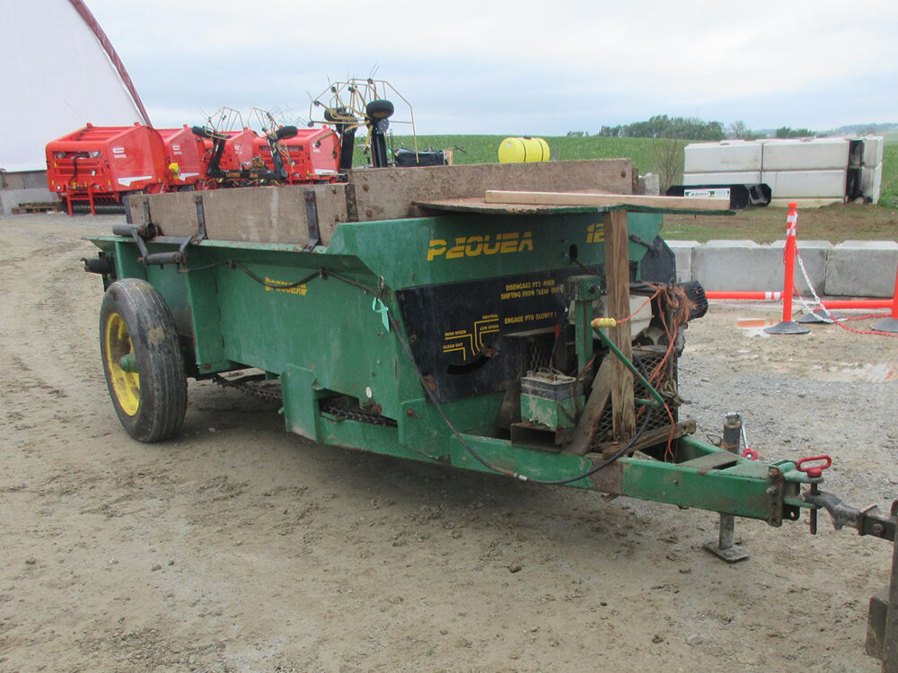 Used manure spreader, Pequea 125, with engine. Fines pan included