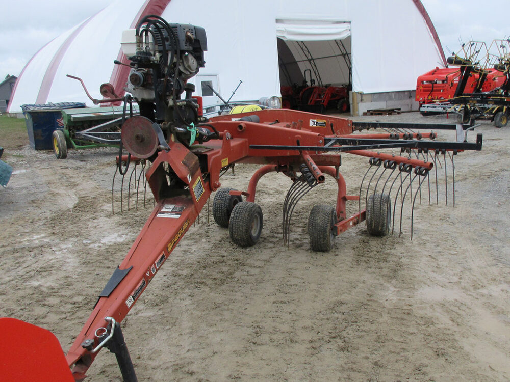 Used Pequea rotary rake with engine and serial #84048.