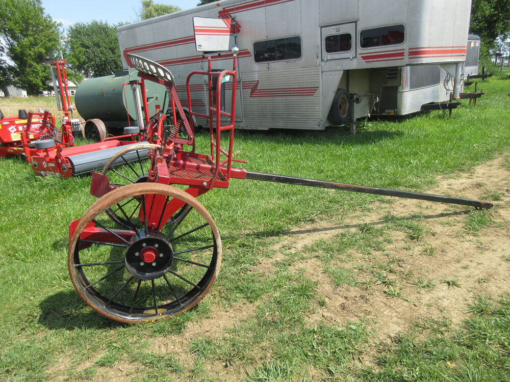 Used equipment: Pioneer logging cart with steel wheels, in good condition; the guard is bent.