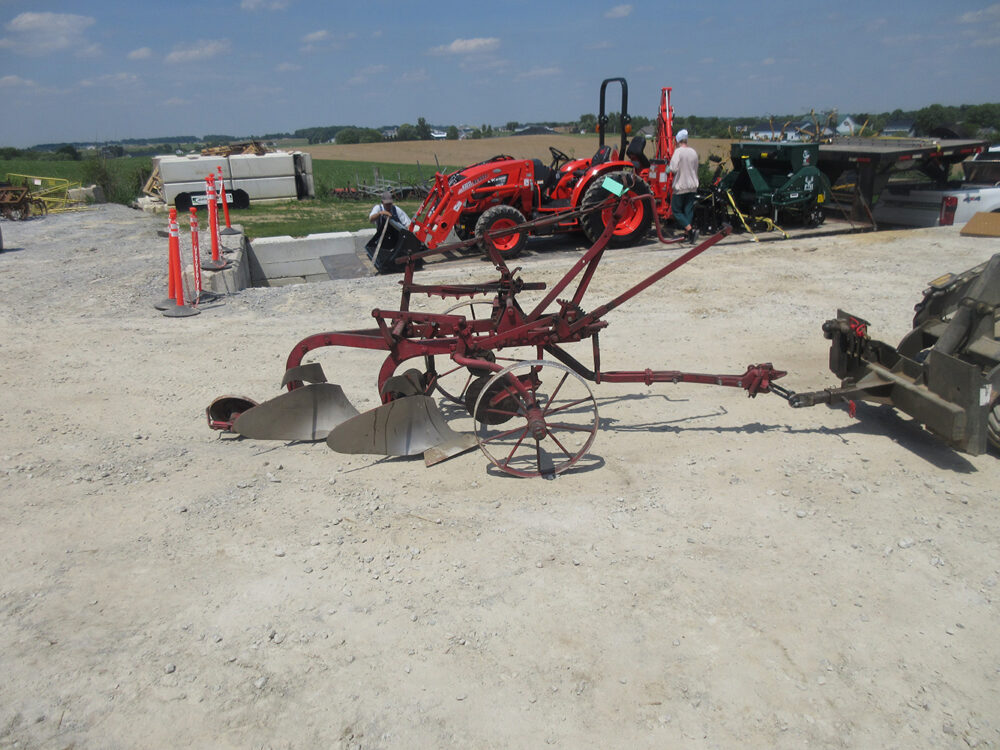 Used equipment: Plow in fair condition with some wear.