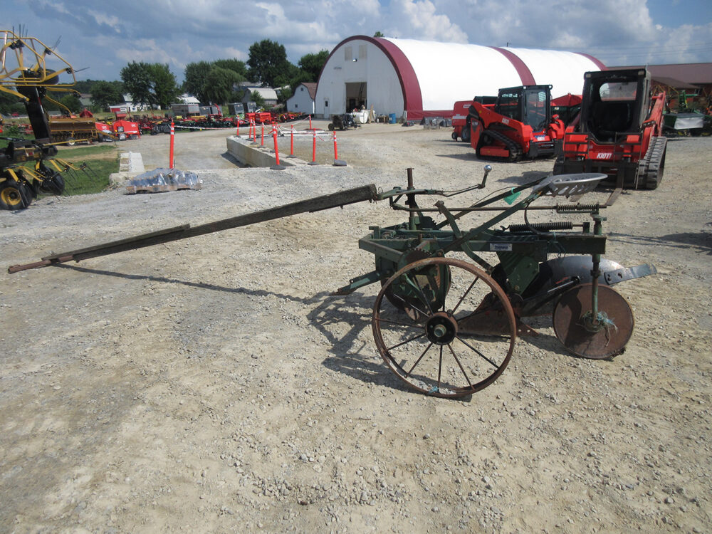 Used equipment: Pioneer foot-lift plow with KV bottoms, in rough condition.