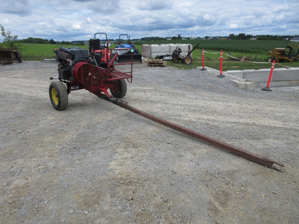 Used equipment: Pioneer PTO cart, 54 HP, approximately 700 hours, straight tongue, foot pedal brake, four hydraulic outlets, recently serviced with fresh oil.