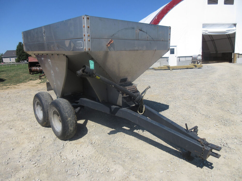 Used Stoltz RC50 fertilizer spreader for fertilizer and lime, approx 5-ton capacity, single spinner, PTO-driven spinner, ground-driven web, and field ready.