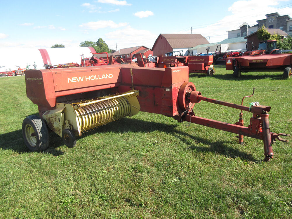 Used equipment: New Holland 311 square baler with Super Sweep, serviced and field ready, tires have some dry rot.