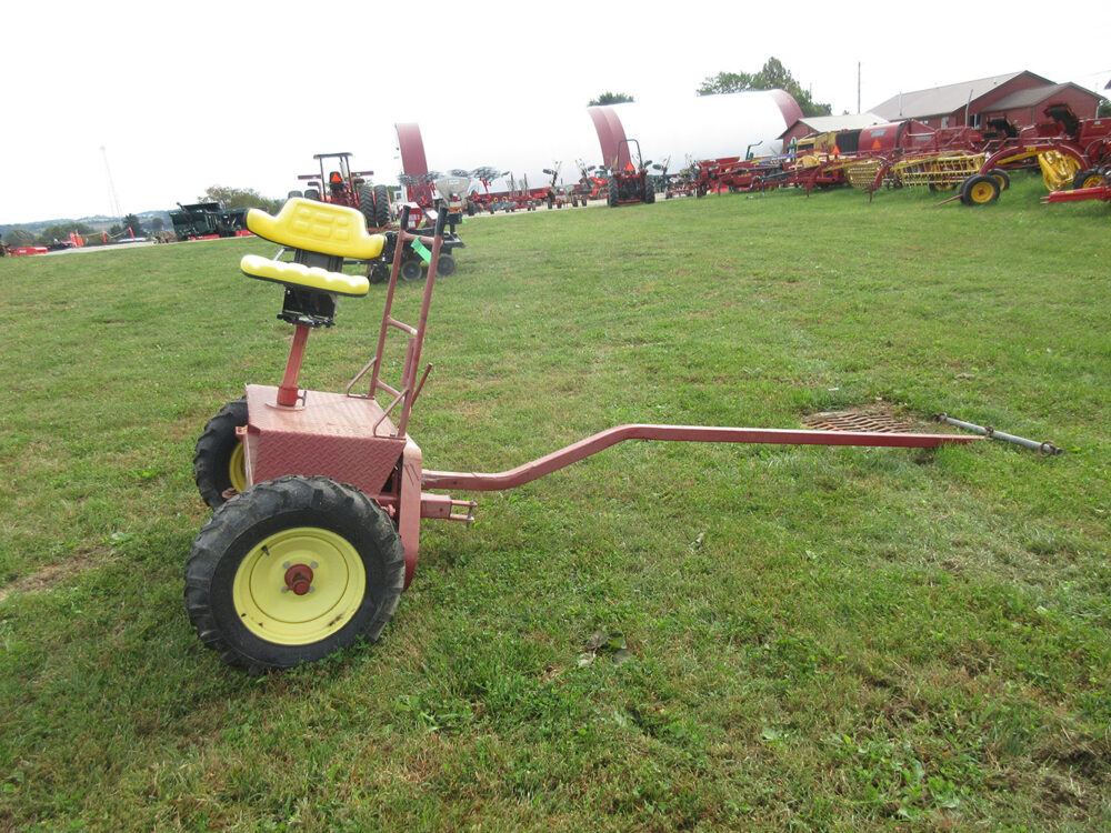 Used equipment: I&J PTO cart, smaller version with ground drive, tractor seat, neck yoke included, and air tire, lightly used with faded paint, in excellent condition.