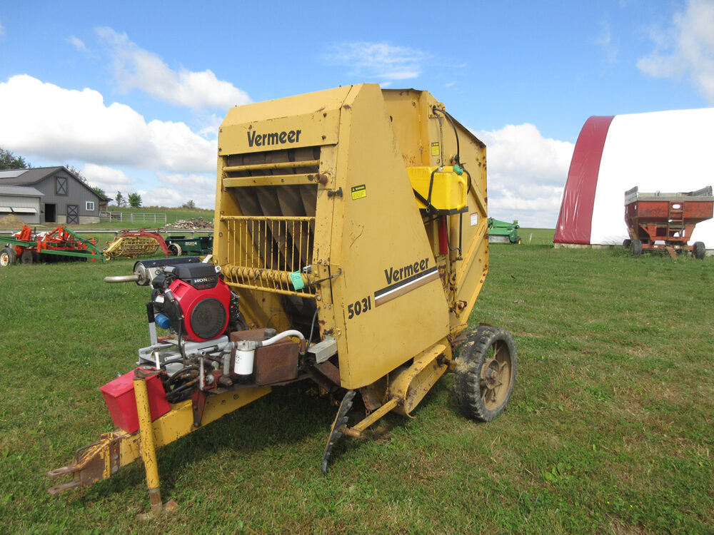 Used equipment: Vermeer 503i round baler, 3x4 bale size, twine tie, new self-contained 22 HP Honda engine, self-contained hydraulics, steel wheels with rubber (one wheel has no rubber), some tines are missing and bent, belts are worn, gather wheels are broken, operator's manual included, in poor condition