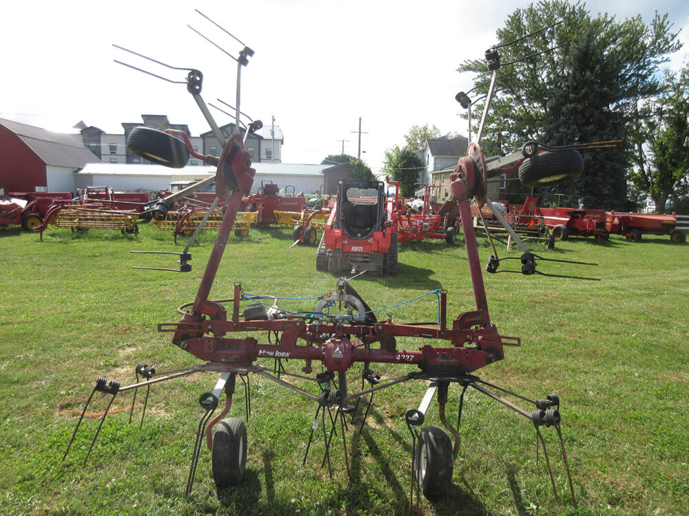 Used equipment: New Idea 4227 tedder, 4-star, 27' working width, hydraulic lift, hand-crank tilt, in good condition, serial number YR6T0214
